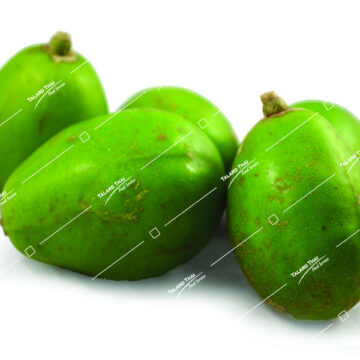 Fresh Makok Laohog Plum displayed on a wooden surface.